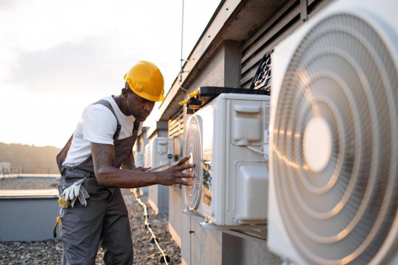 male-holding-tablet-and-installing-cooling-system-2023-12-21-22-00-44-utc-2.jpg